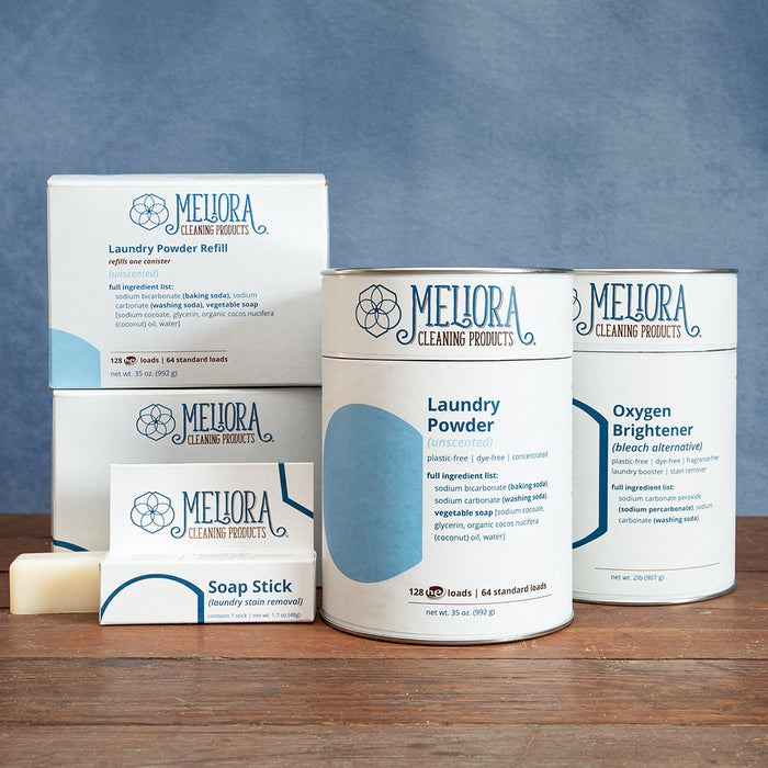 A photo of the Laundry Collection from Meliora Cleaning Products featuring Laundry Powder (detergent), Oxygen Brightener (bleach alternative), and Soap Stick (stain remover).