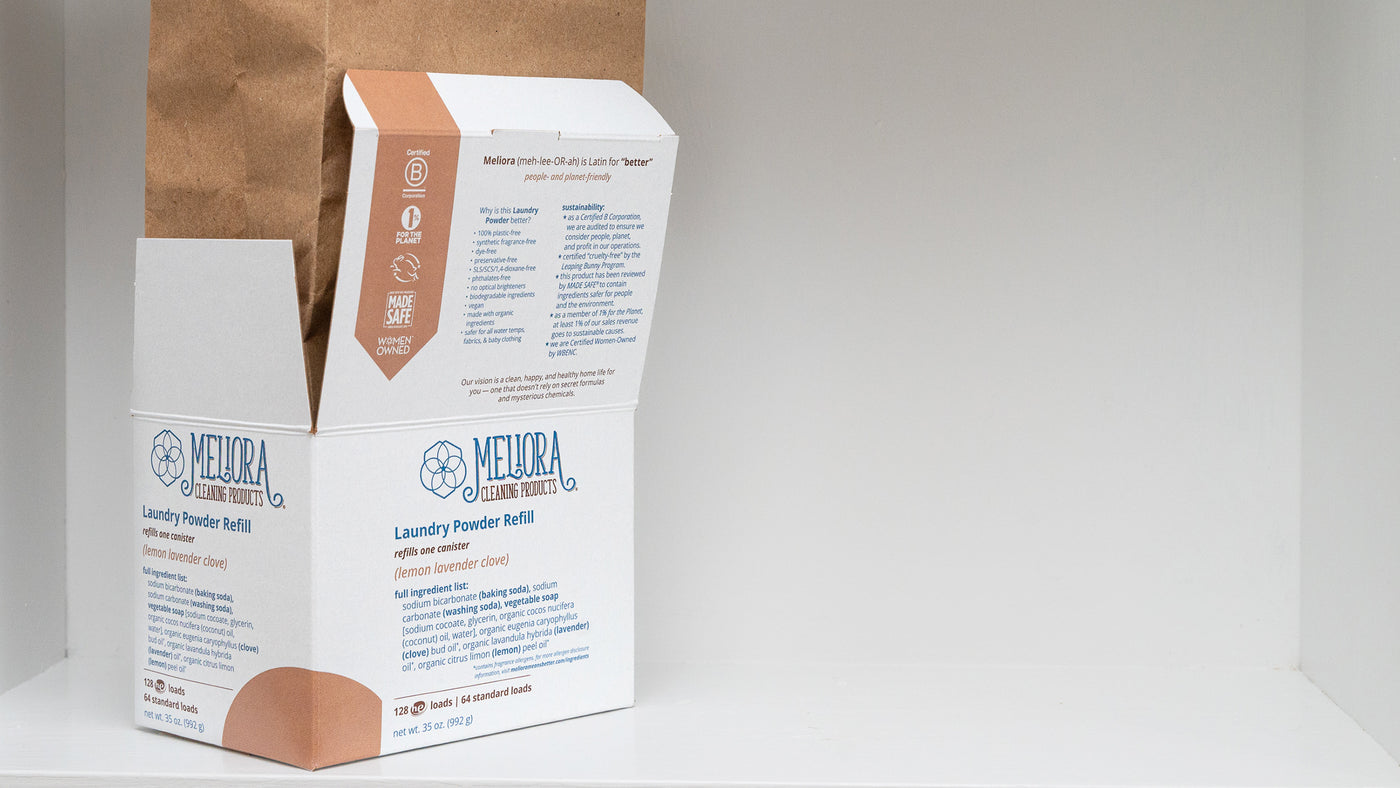 A photo of a Meliora Laundry Powder all-paper refill box on a shelf.